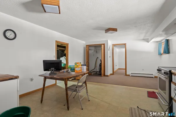 a bathroom with a sink mirror vanity and toilet