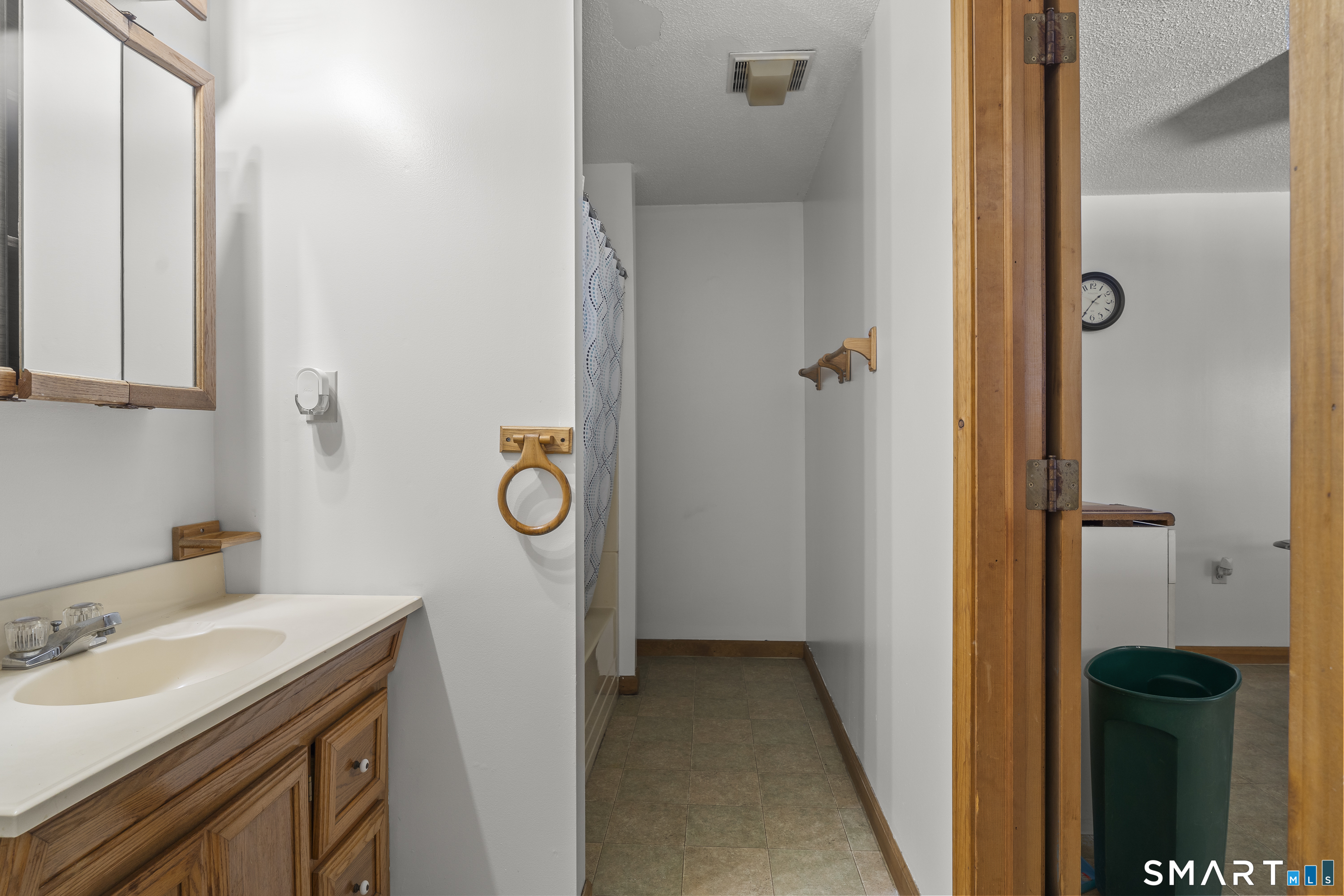 172 Old Willimantic Road Columbia, CT 06237 - Photo 35 of 39 a bathroom with a granite countertop sink and a mirror