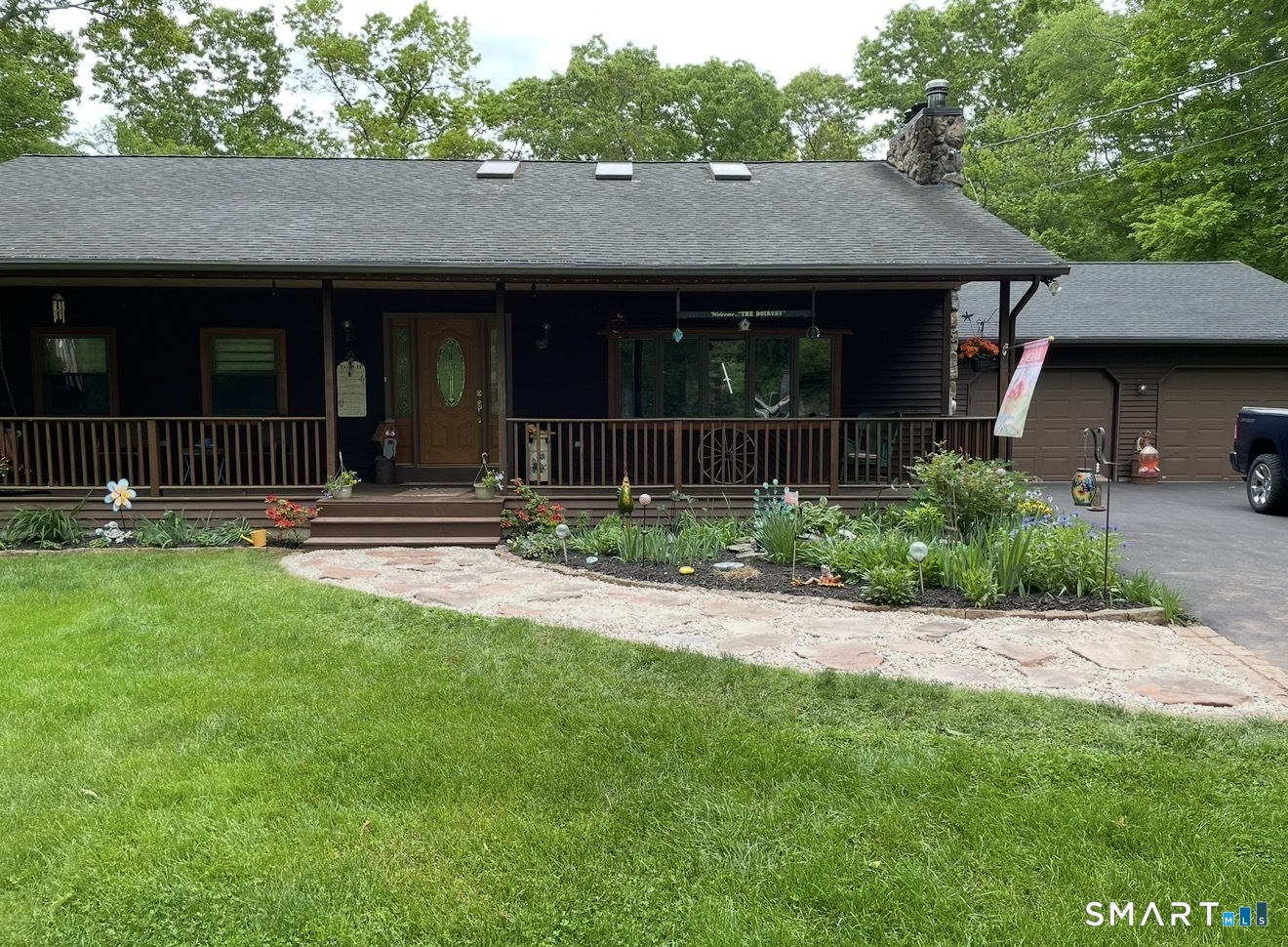 172 Old Willimantic Road Columbia, CT 06237 - Photo 4 of 39 a front view of a house with a yard