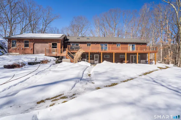 a view of large house with a patio