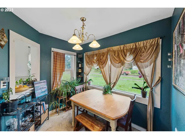a view of entryway with furniture and chandelier