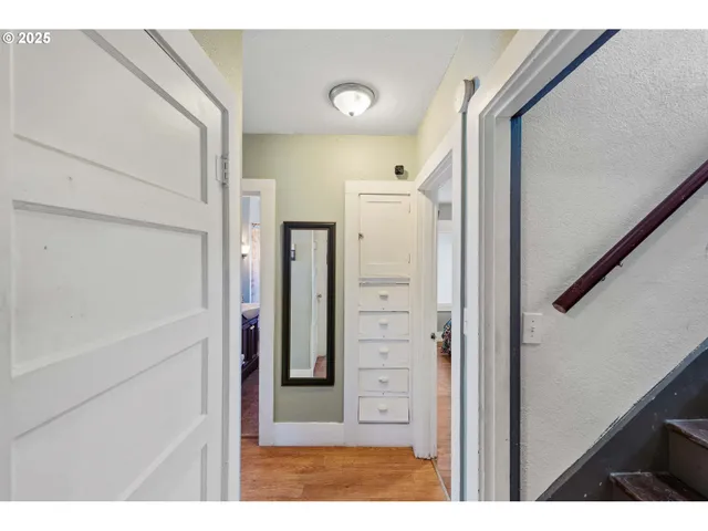 a bedroom with a bed and a dresser in it