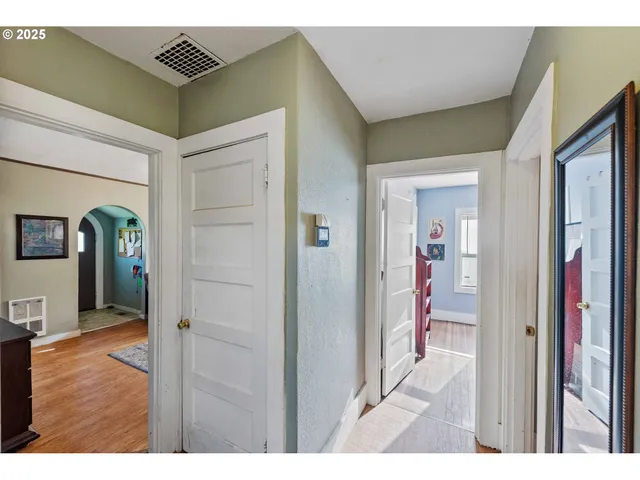 a view of a bedroom from a hallway