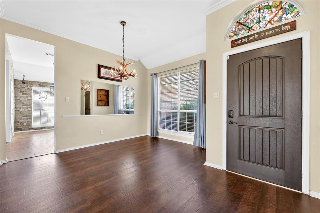 13616 Bates Aston Road Haslet, TX 76052 - Photo 14 of 36 a view of an empty room with wooden floor and a window