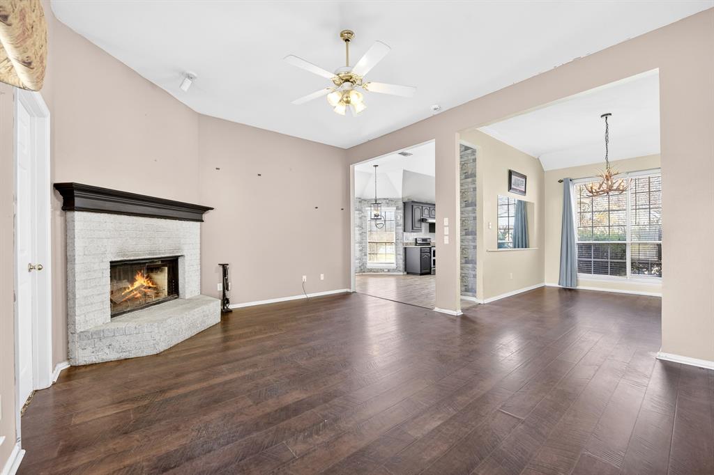 13616 Bates Aston Road Haslet, TX 76052 - Photo 17 of 36 a view of an empty room with a fireplace and a window