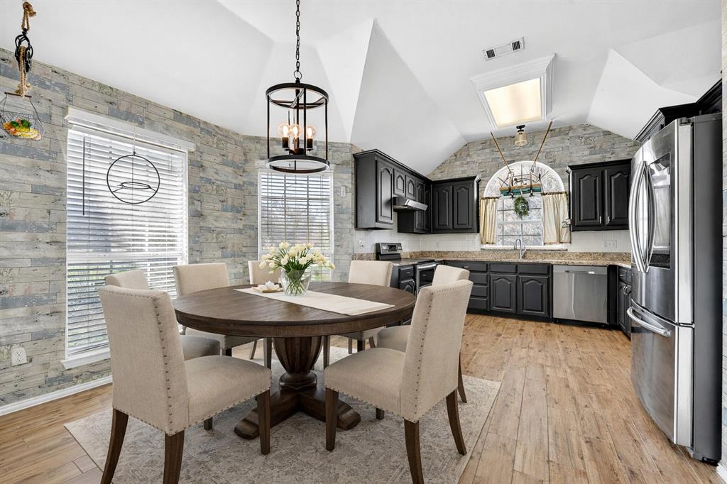 13616 Bates Aston Road Haslet, TX 76052 - Photo 18 of 36 a view of a dining room with furniture and a chandelier