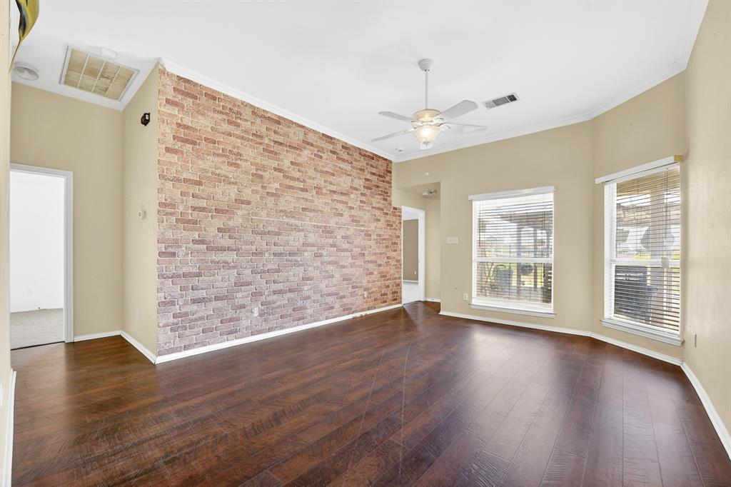 13616 Bates Aston Road Haslet, TX 76052 - Photo 24 of 36 a view of an empty room with wooden floor and a window