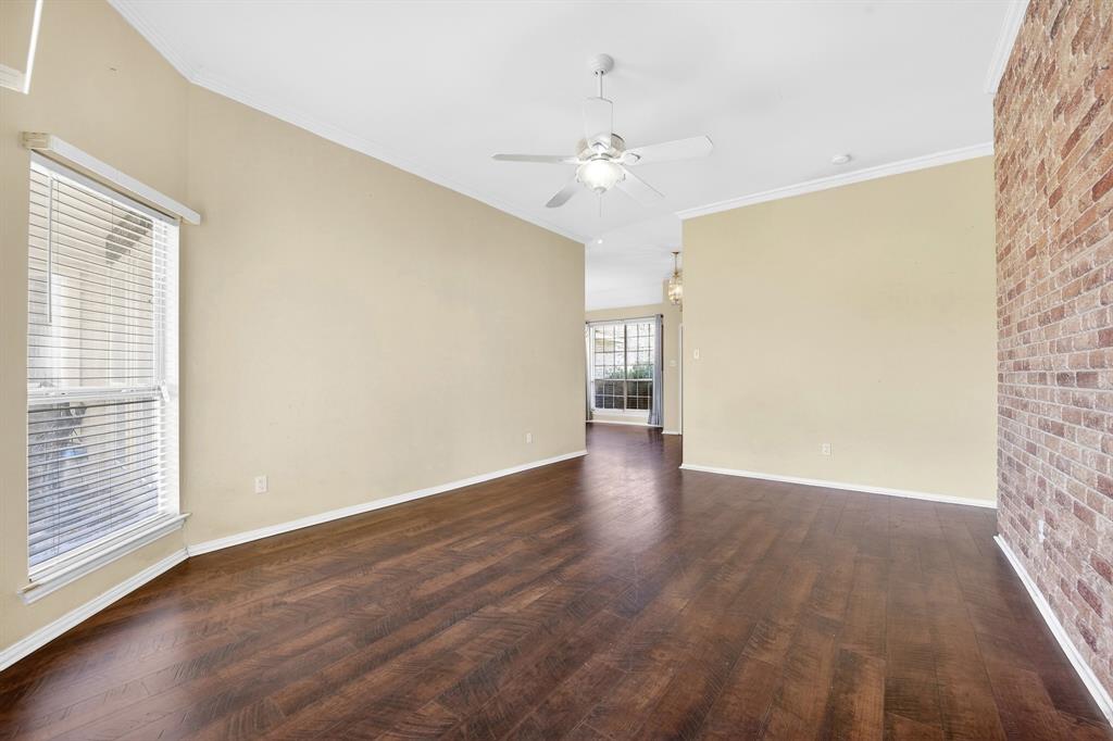 13616 Bates Aston Road Haslet, TX 76052 - Photo 25 of 36 a view of an empty room with wooden floor and a window