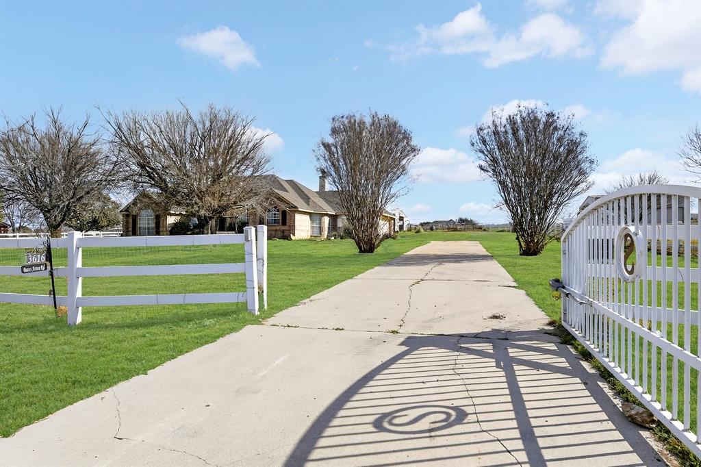 13616 Bates Aston Road Haslet, TX 76052 - Photo 5 of 36 a view of a yard with palm trees