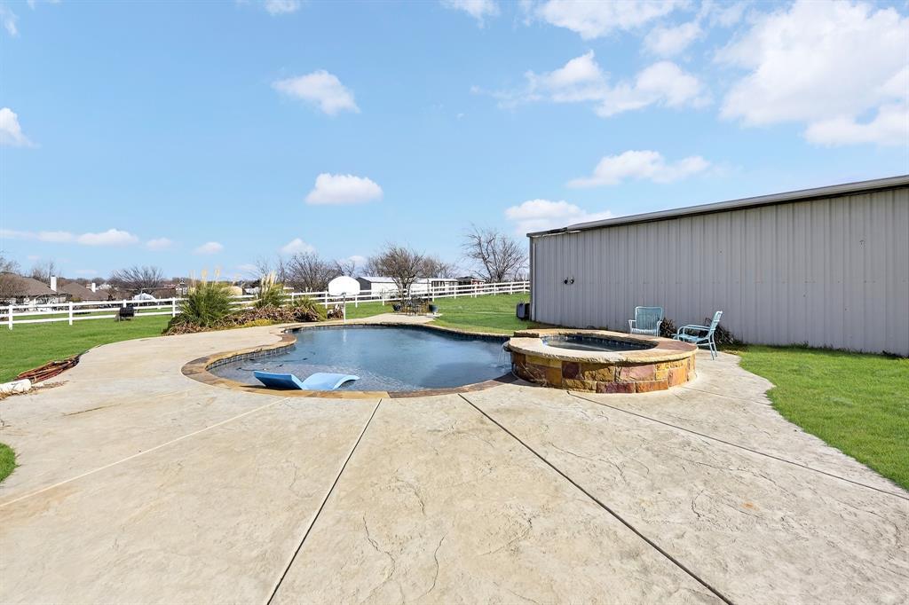 13616 Bates Aston Road Haslet, TX 76052 - Photo 7 of 36 a view of a swimming pool with a yard and plants