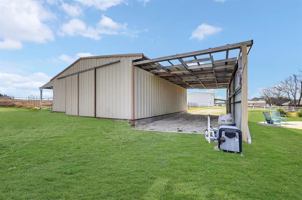 13616 Bates Aston Road Haslet, TX 76052 - Photo 10 of 36 a view of a backyard with plants and a garden