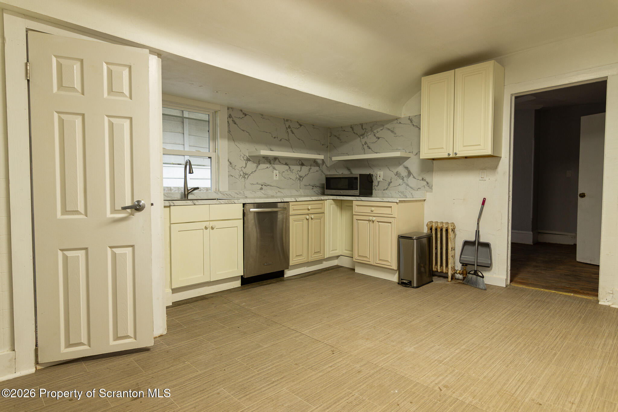 214 William Street Scranton, PA 18508 - Photo 7 of 33 a kitchen with a sink and cabinets