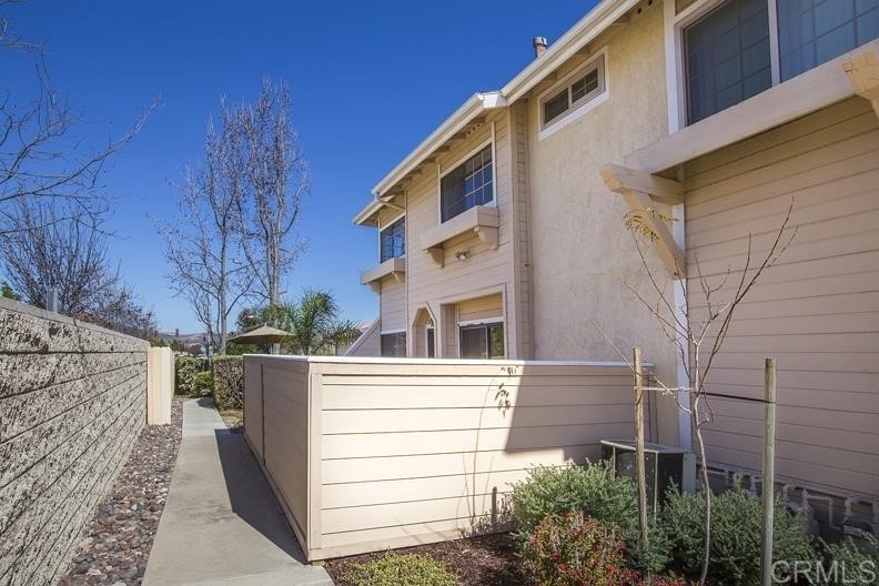 8860 Tamberly Way, Unit C Santee, CA 92071 - Photo 1 of 1 a view of a house with a yard