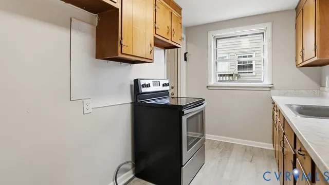 a kitchen with a refrigerator stove and microwave
