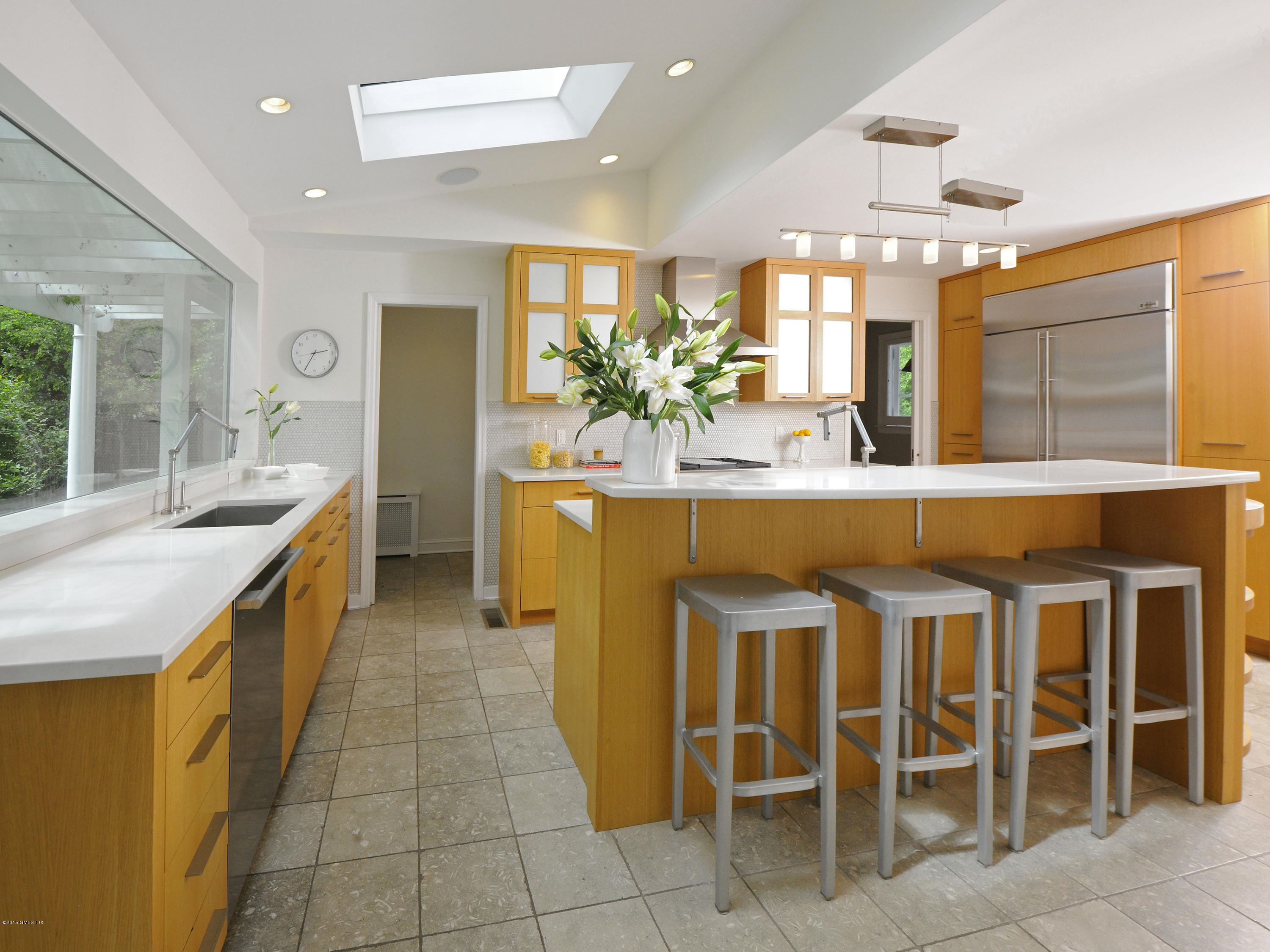 14 Spruce Street Riverside, CT 06878 - Photo 12 of 22 a kitchen with a sink and chairs