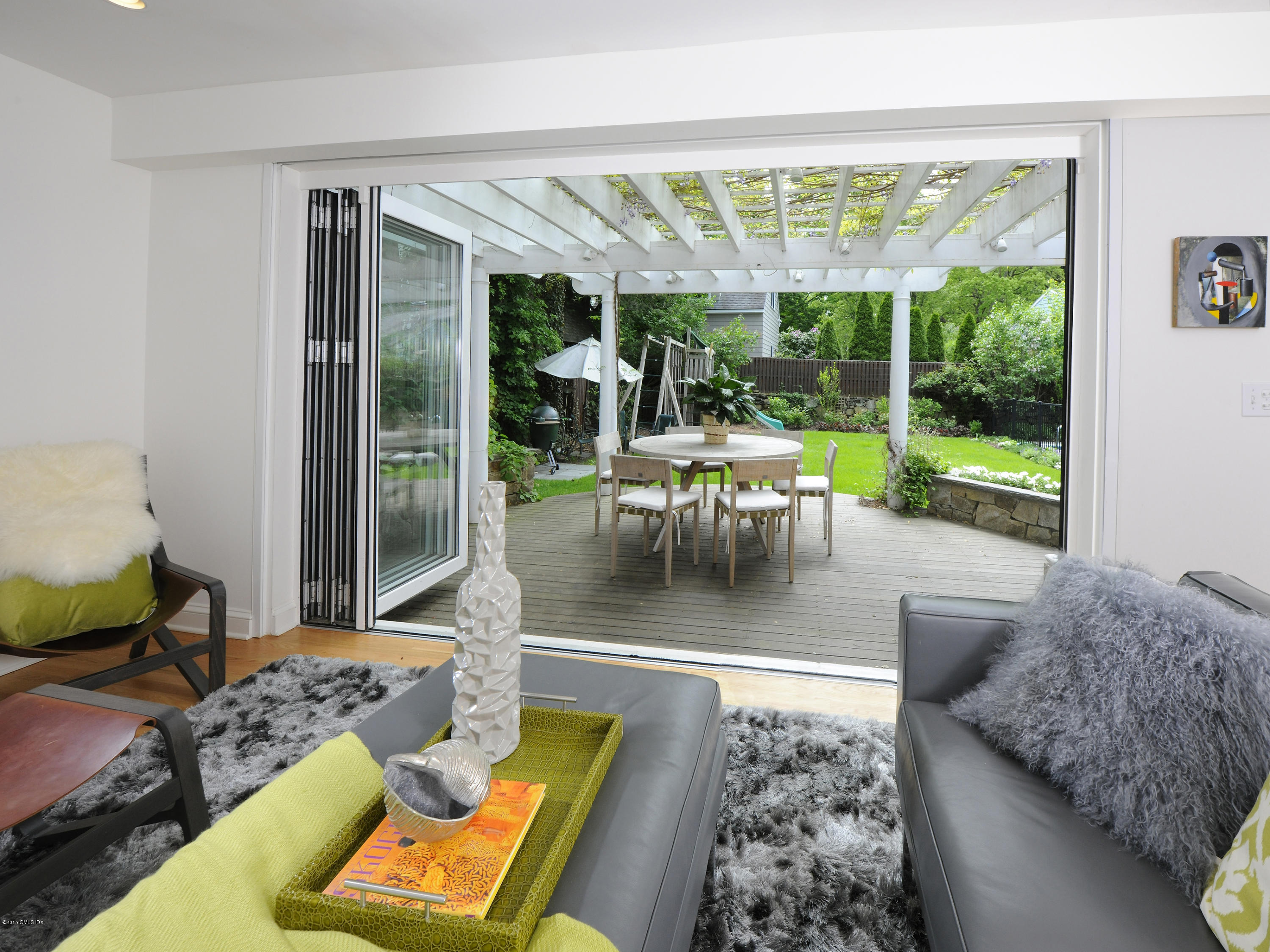 14 Spruce Street Riverside, CT 06878 - Photo 13 of 22 a living room with patio furniture and a large window