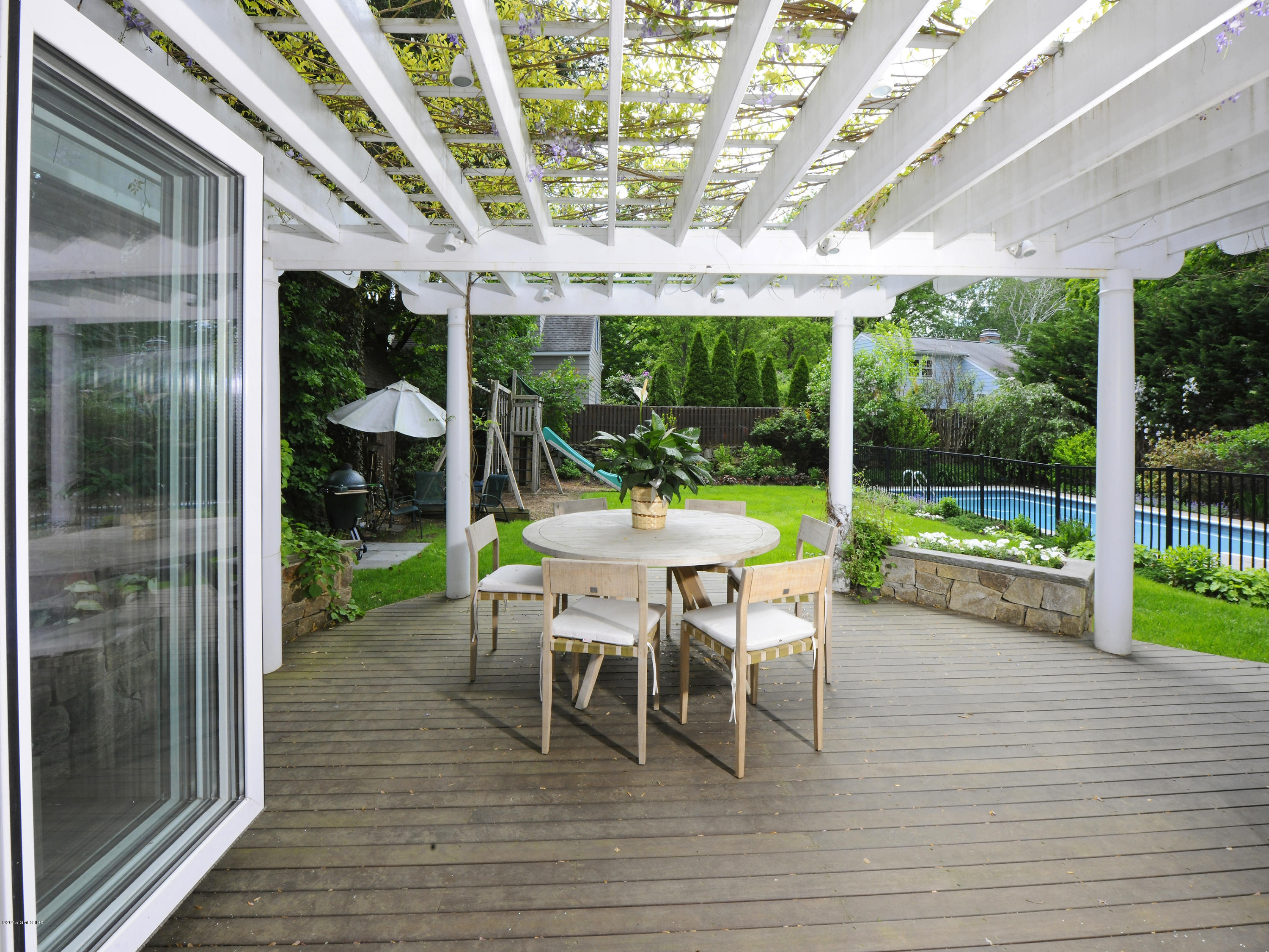 14 Spruce Street Riverside, CT 06878 - Photo 14 of 22 a view of a patio with a dining table and chairs