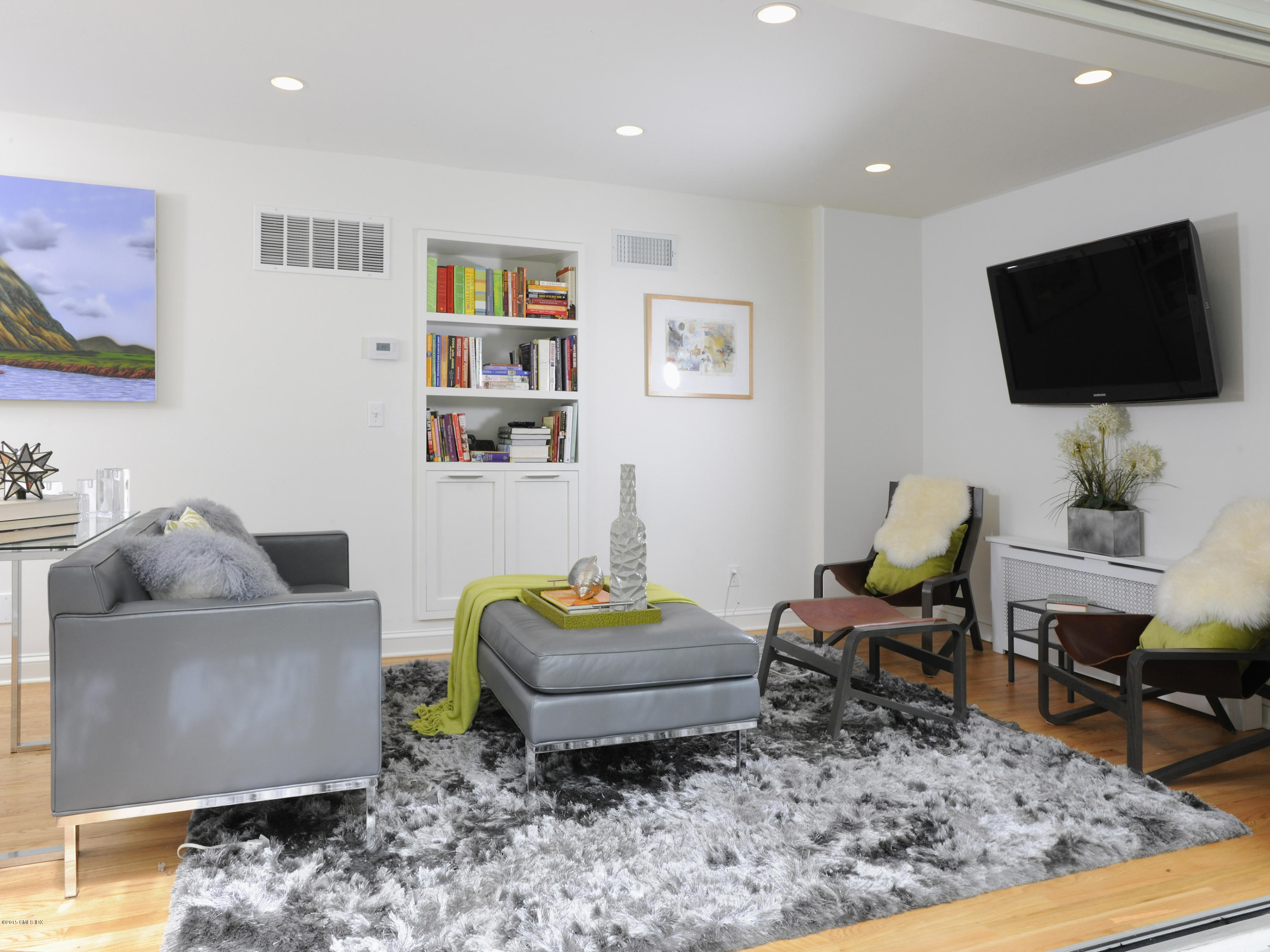 14 Spruce Street Riverside, CT 06878 - Photo 15 of 22 a living room with furniture and a flat screen tv