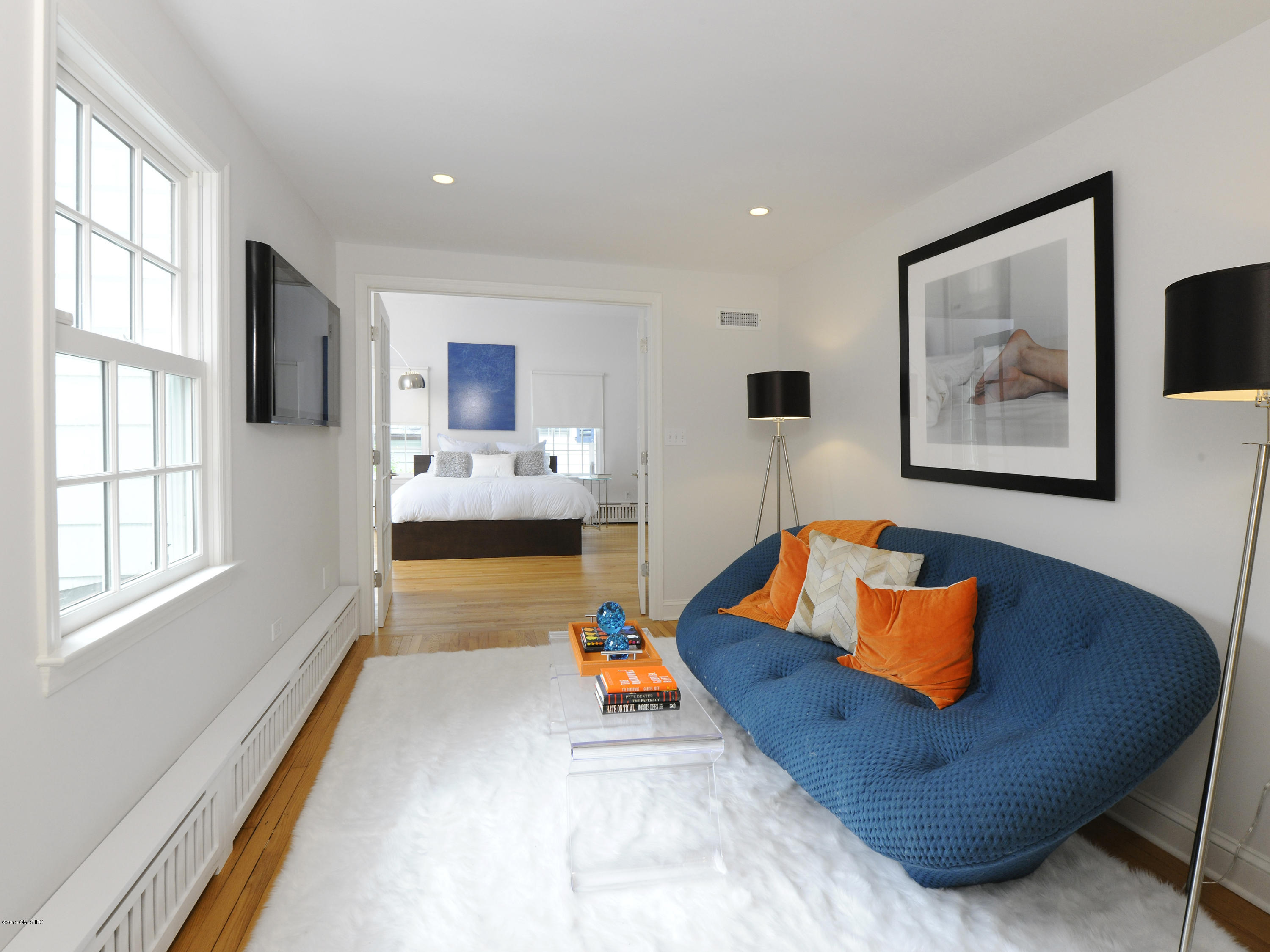 14 Spruce Street Riverside, CT 06878 - Photo 18 of 22 a living room with furniture and a flat screen tv