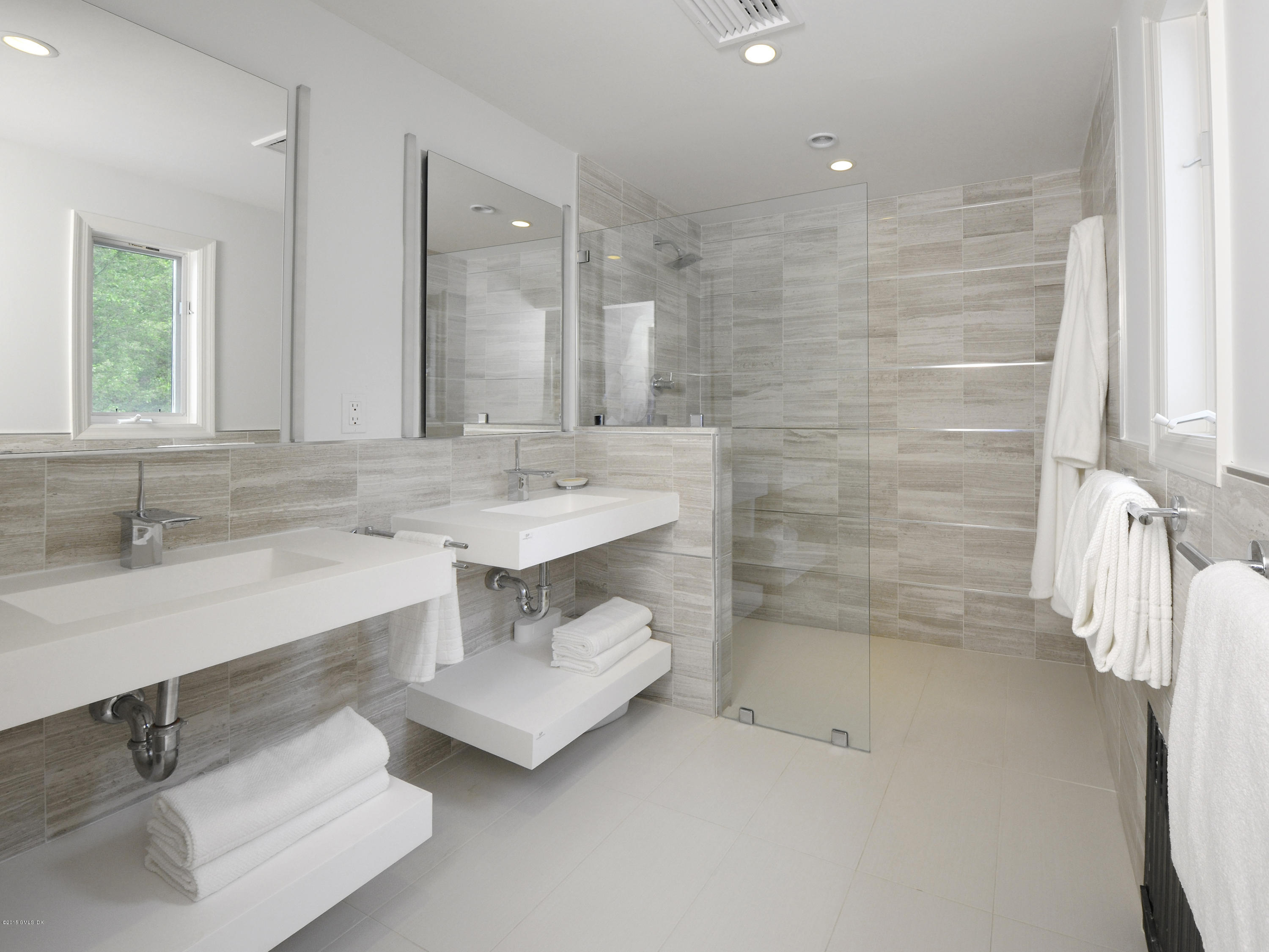 14 Spruce Street Riverside, CT 06878 - Photo 19 of 22 a bathroom with a sink shower and a mirror