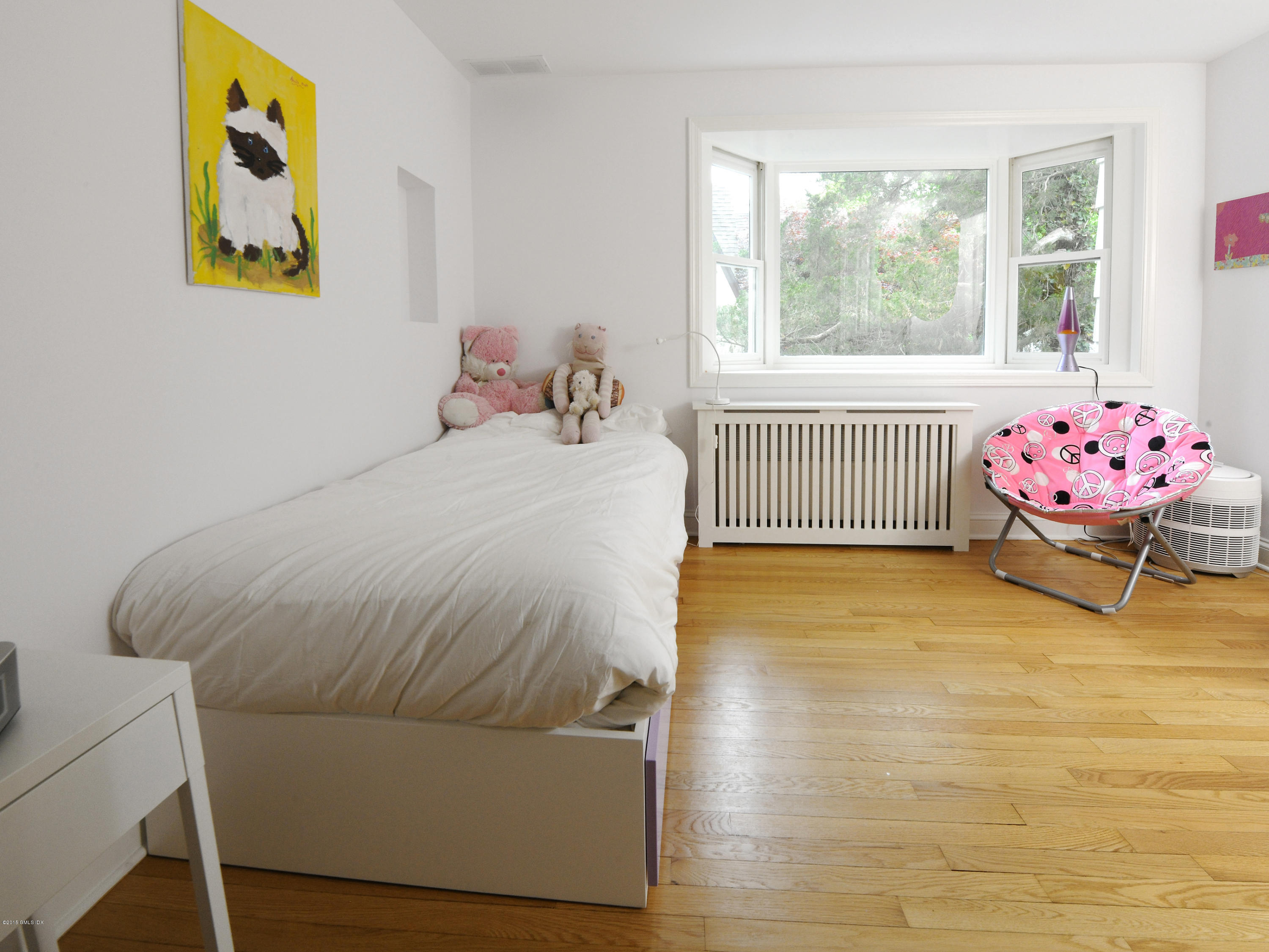 14 Spruce Street Riverside, CT 06878 - Photo 21 of 22 a bedroom with a bed and window