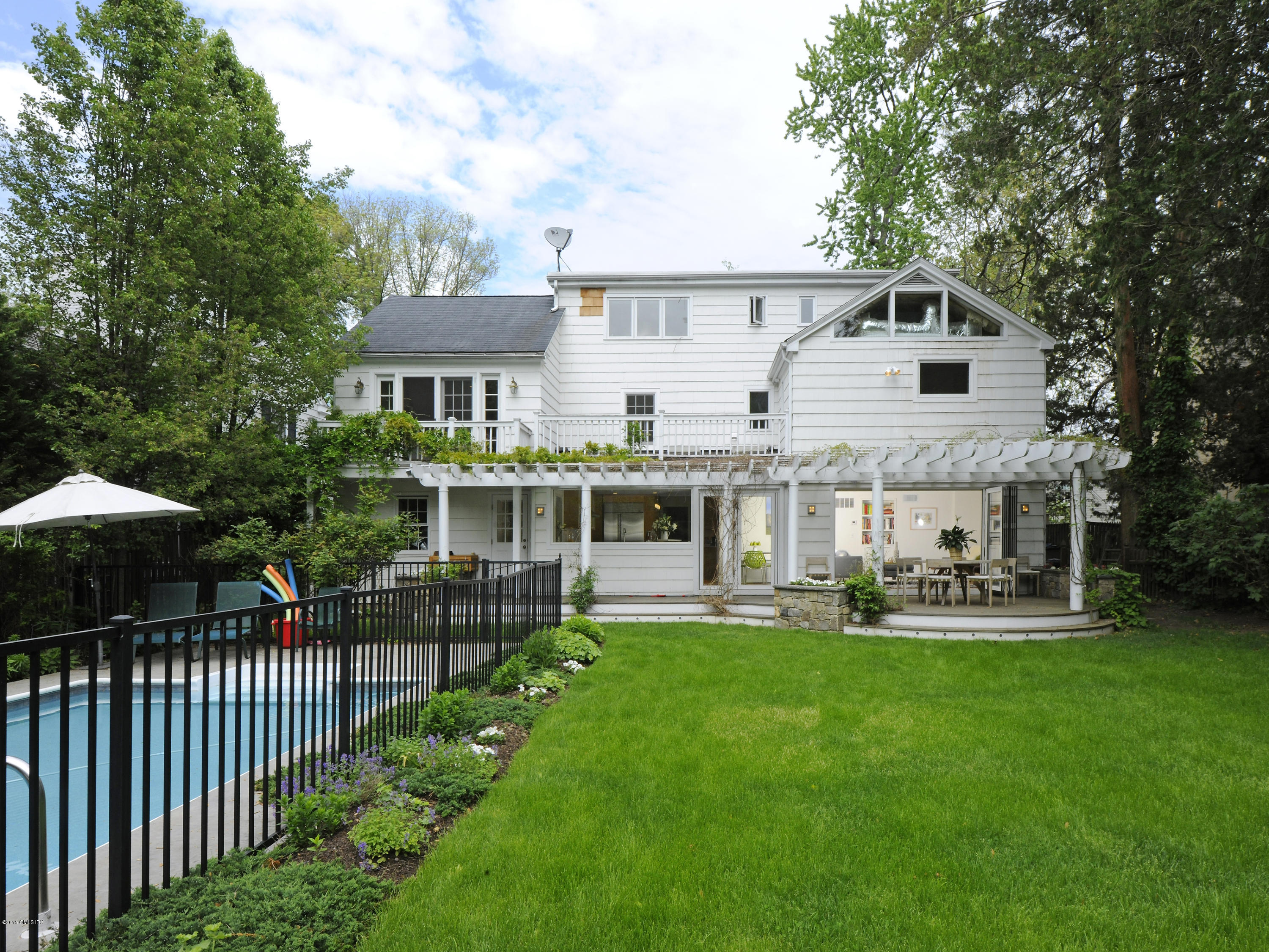 14 Spruce Street Riverside, CT 06878 - Photo 3 of 22 a front view of house with yard and patio