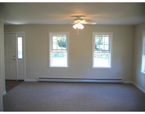 Lot 2 Oakham Road Barre, MA 01005 - Photo 13 of 16 an empty room with wooden floor and windows