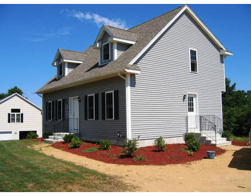 Lot 2 Oakham Road Barre, MA 01005 - Photo 4 of 16 a front view of a house with a yard