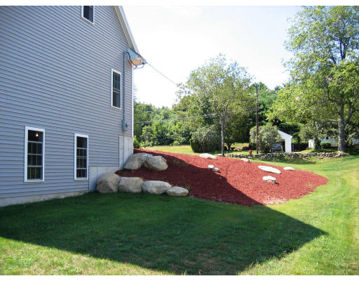 Lot 2 Oakham Road Barre, MA 01005 - Photo 6 of 16 a backyard of a house with table and chairs