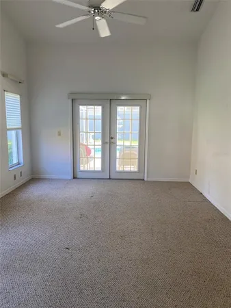 a view of an empty room with a window