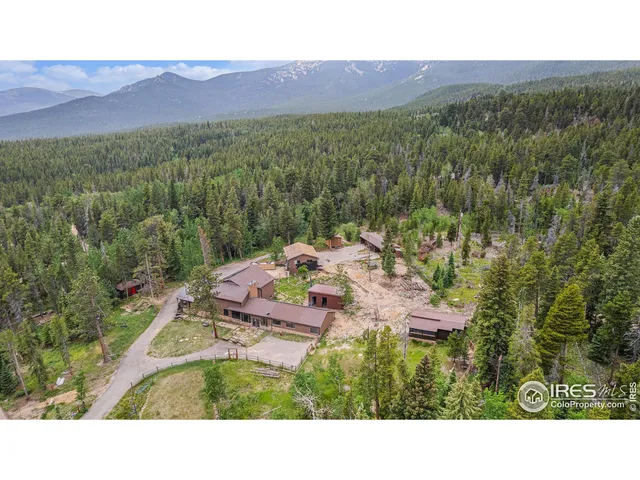 a view of a house with pool and chairs