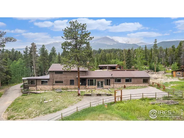 a view of a city with lush green forest