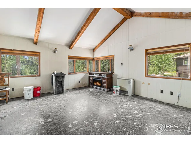 a view of a livingroom with natural light