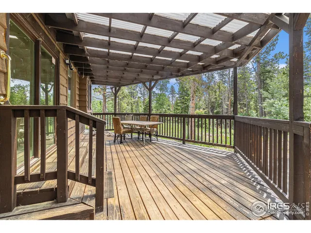 a view of outdoor space with wooden floor