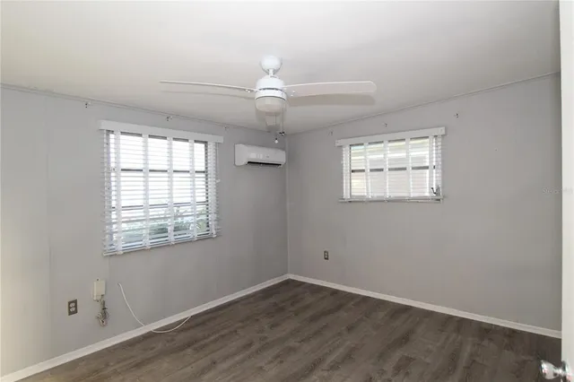 a view of a hallway with a wooden door