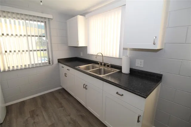 a view of a hallway to a window