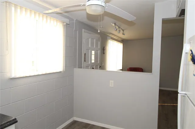 a view of a kitchen cabinets and window