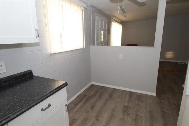 a view of a house with street that has a street