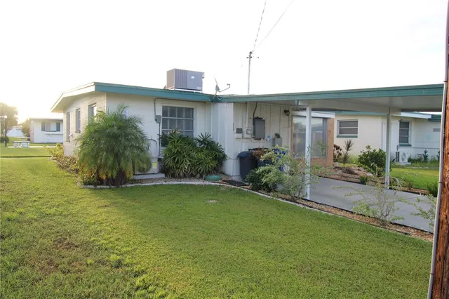 a view of room with window and wooden floor