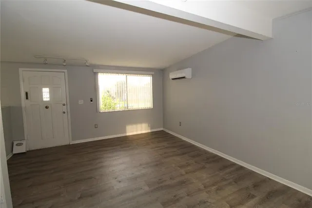 a view of an empty room and window