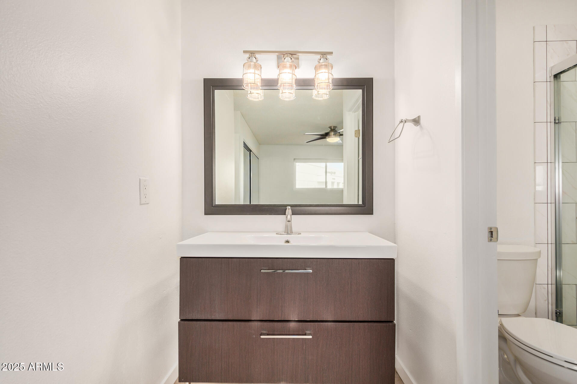 5525 East Thomas Road, Unit C4 Phoenix, AZ 85018 - Photo 21 of 34 a bathroom with a sink and a mirror