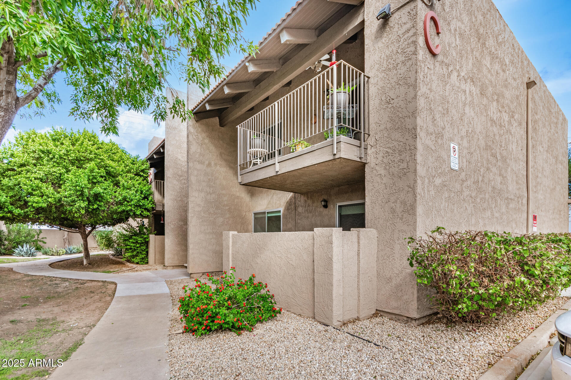 5525 East Thomas Road, Unit C4 Phoenix, AZ 85018 - Photo 3 of 34 a view of a house with a garden