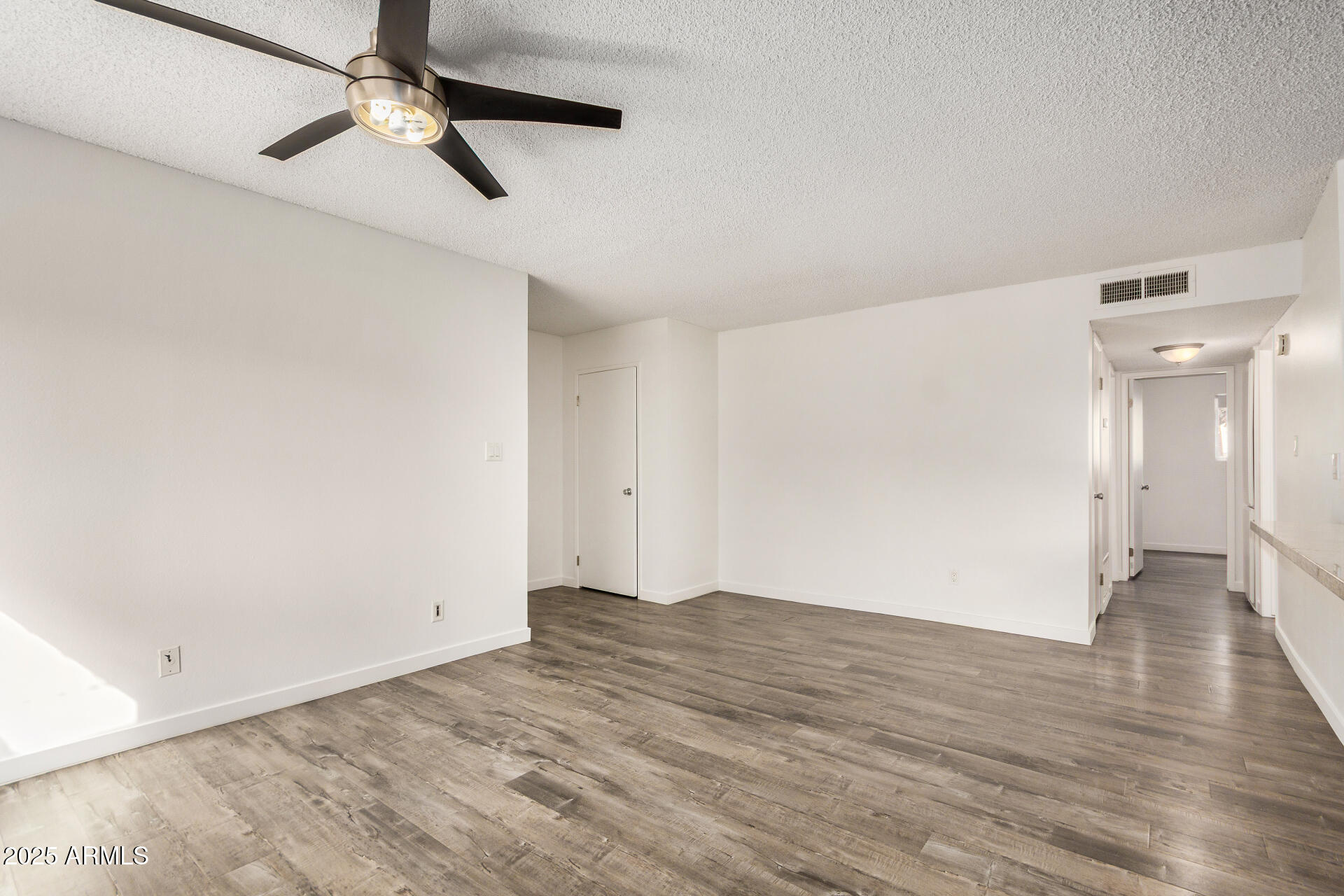 5525 East Thomas Road, Unit C4 Phoenix, AZ 85018 - Photo 8 of 34 wooden floor in an empty room