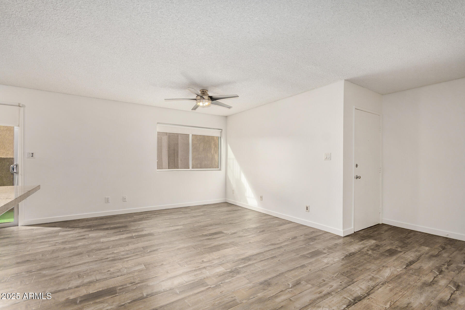 5525 East Thomas Road, Unit C4 Phoenix, AZ 85018 - Photo 9 of 34 wooden floor in an empty room