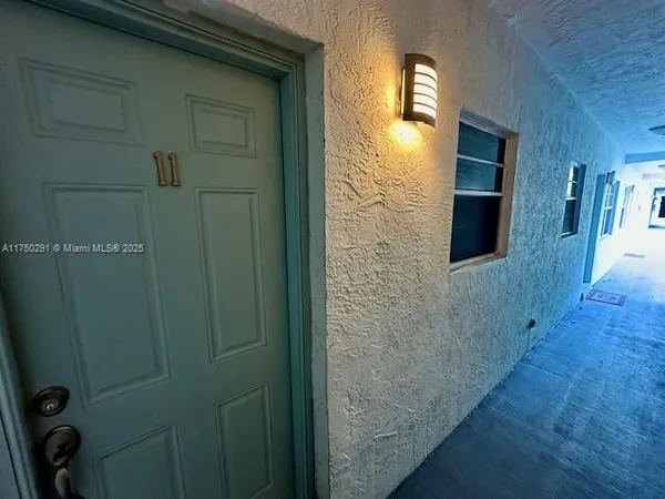 a bathroom with a shower and a mirror