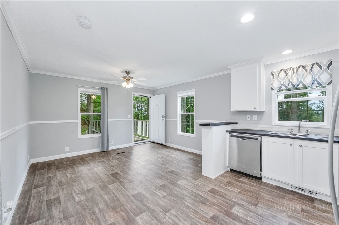 939 Don Bare Road Jefferson, NC 28640 - Photo 38 of 49 a view of a kitchen with wooden floor and a window