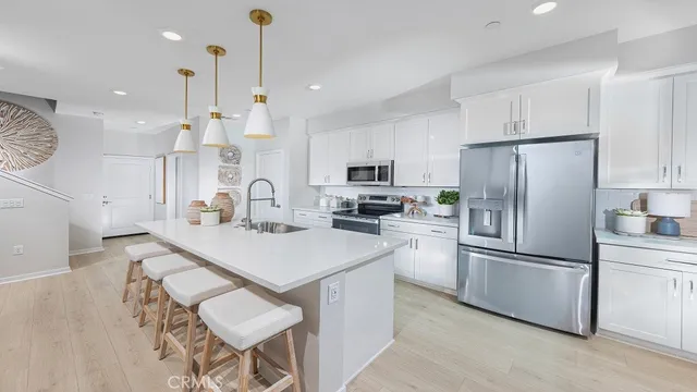 a kitchen with refrigerator cabinets and a counter top