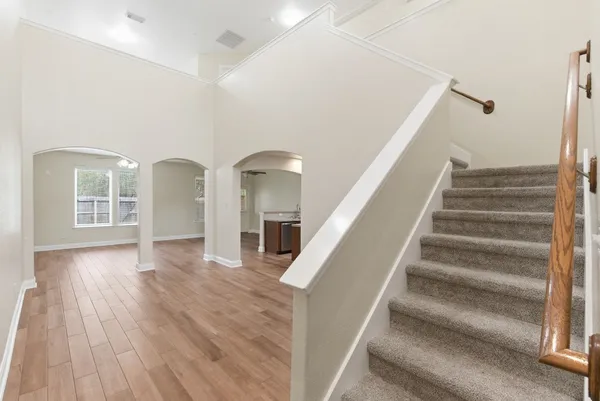 a view of staircase with white walls and floors