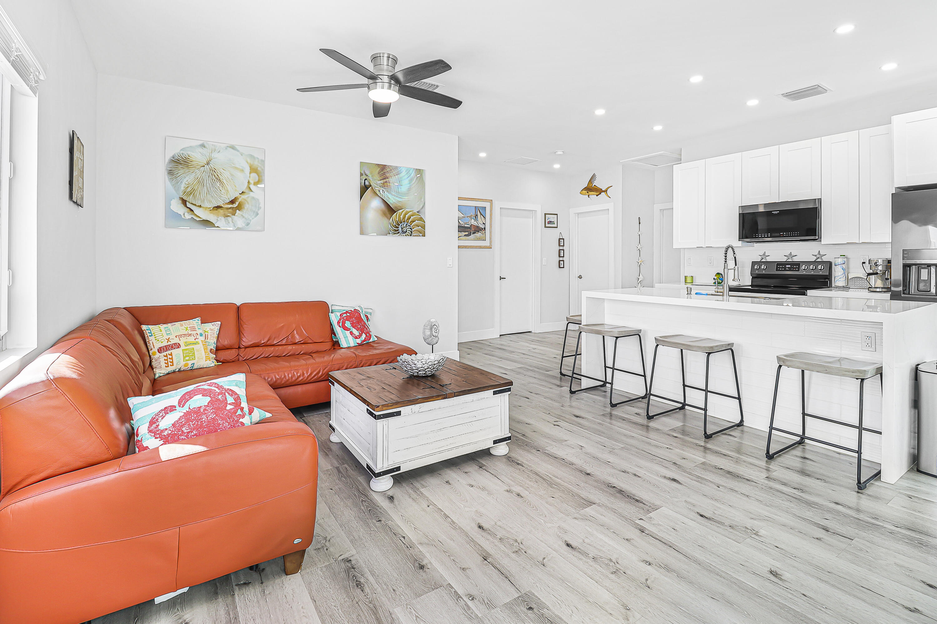 31575 Ave D Big Pine Key, FL 33043 - Photo 11 of 35 a living room with furniture and a wooden floor