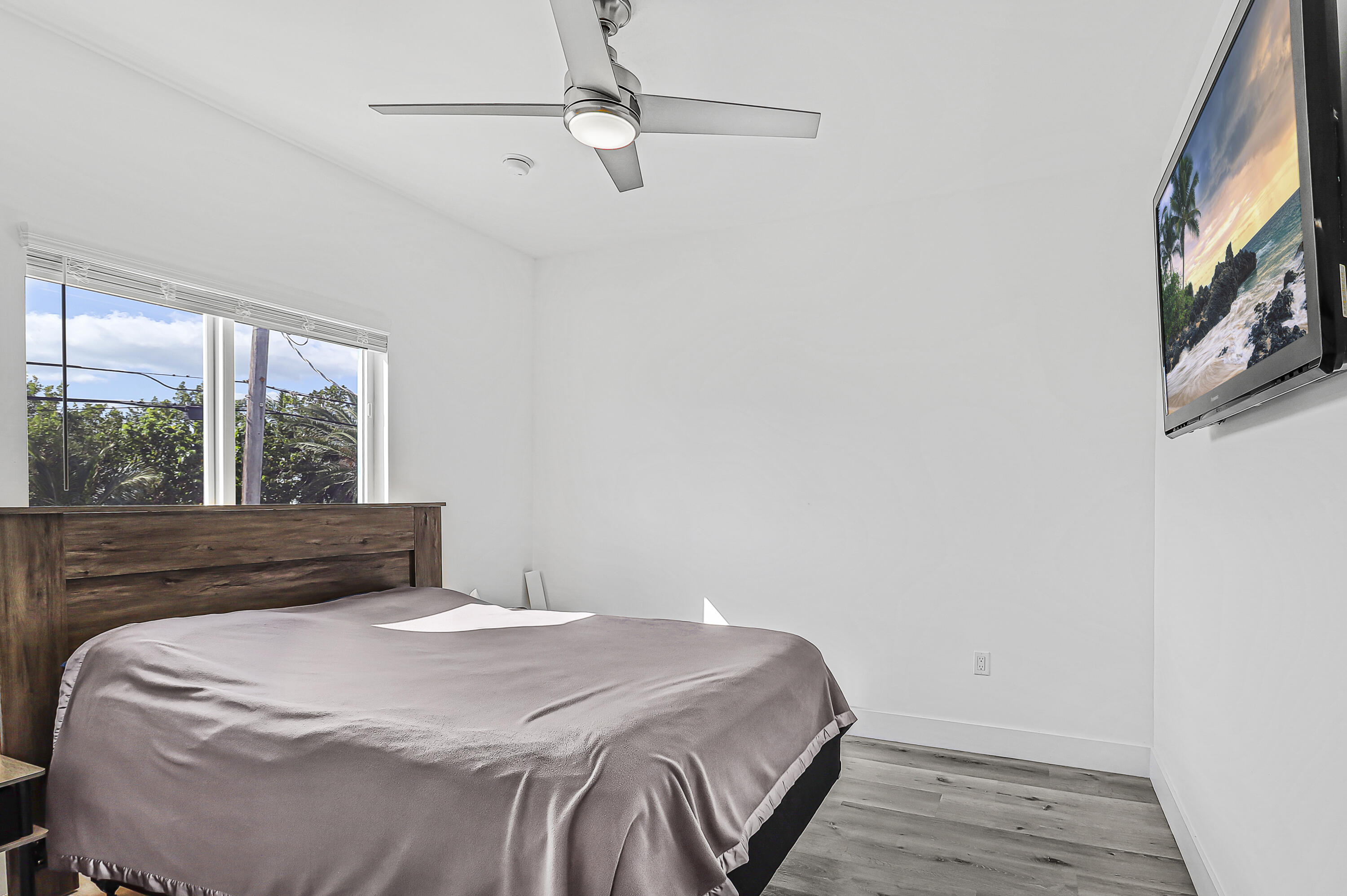 31575 Ave D Big Pine Key, FL 33043 - Photo 18 of 35 a bedroom with a bed and a large window